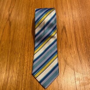 DeLaurentiis cinema Italian made in Italy silk tie.  Tie is blue, yellow, silver
